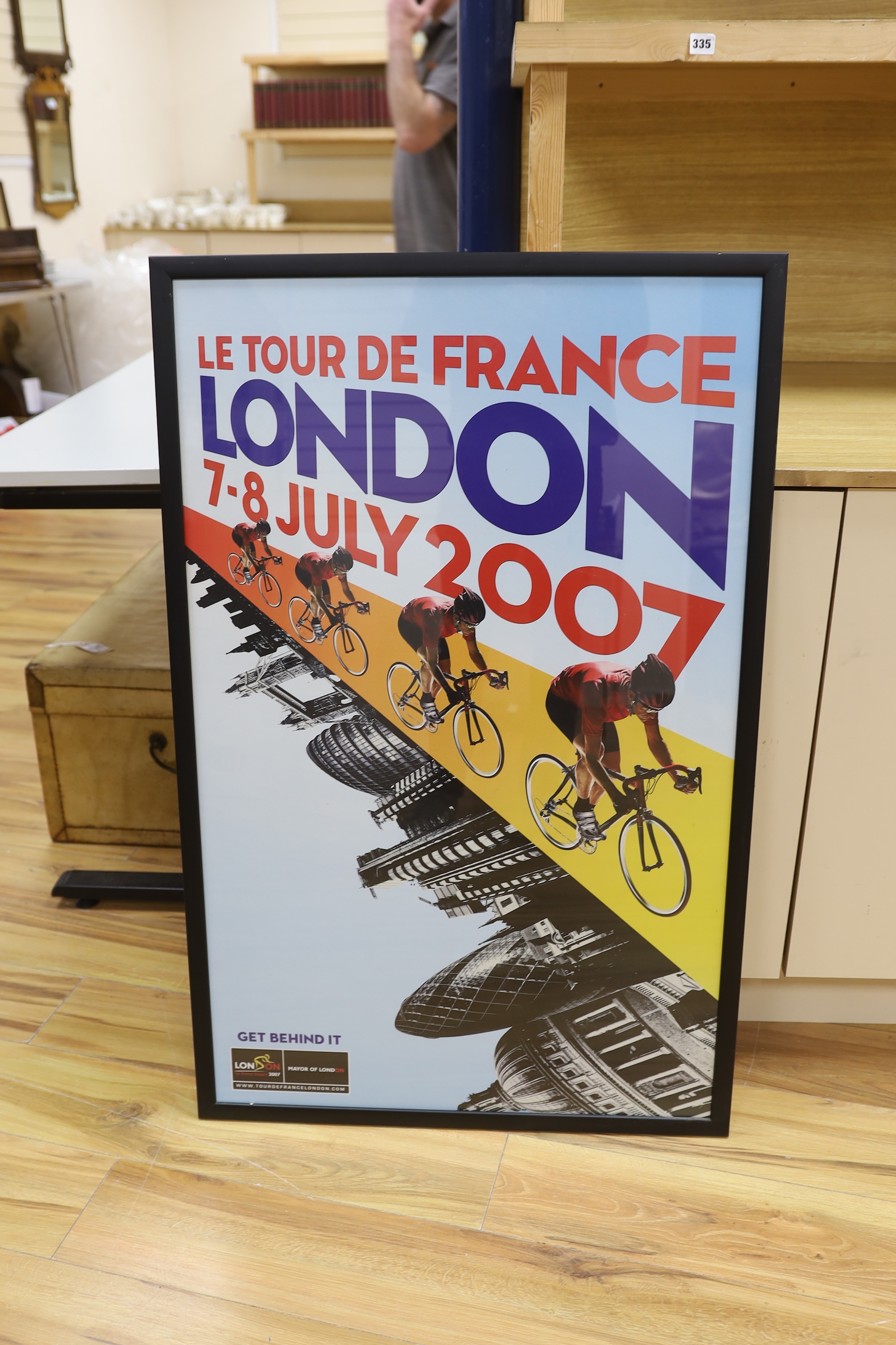 A set of four Tour De France posters, framed